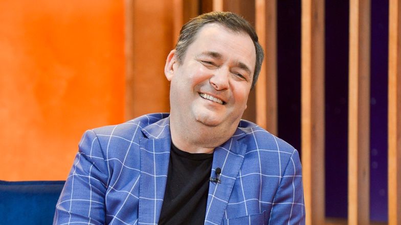 Jacek Rozenek pozuje z tajemniczą brunetką 