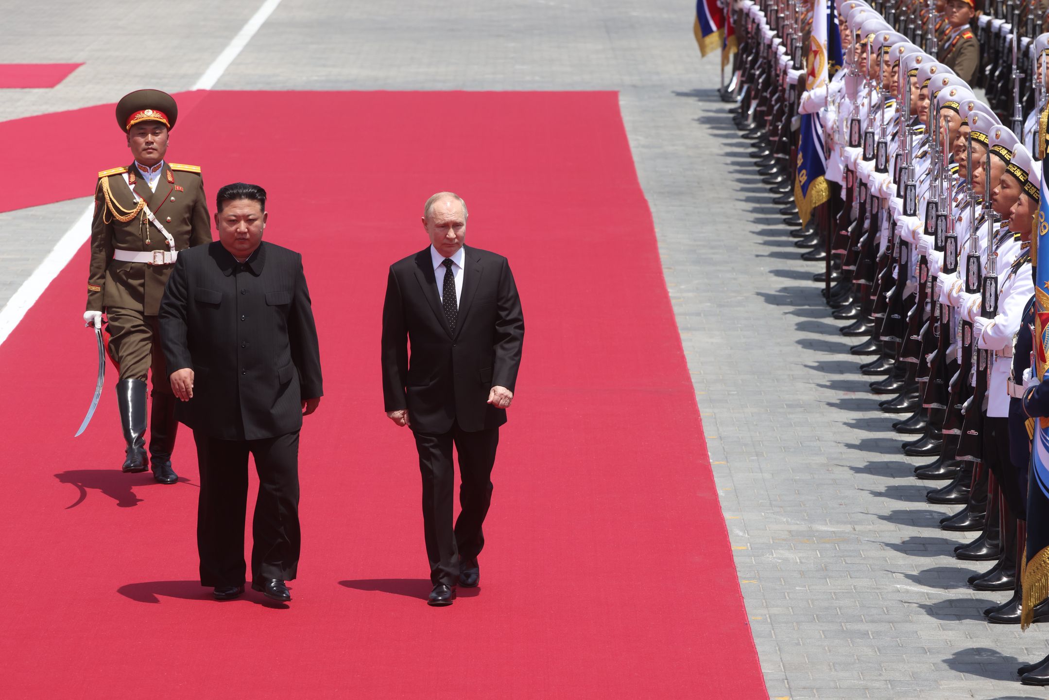 PYONGYANG, NORTH KOREA - JUNE 19: (RUSSIA OUT) Russian President Vladimir Putin (R) and North Korean Supreme Leader Kim Jong Un attend a welcoming ceremony on June 19, 2024 in Pyongyang, North Korea. Russian President Vladimir Putin is in North Korea for a two-day state visit. (Photo by Contributor/Getty Images)
