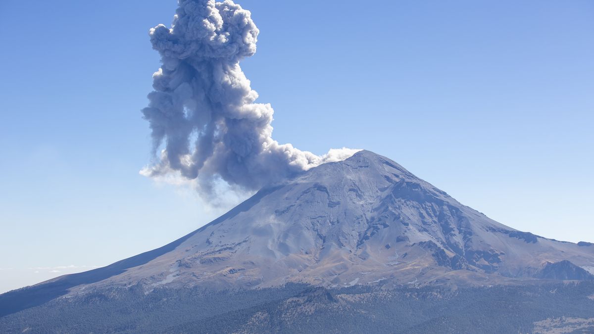 PUEBLA, MEXICO - JANUARY 24: A view of a column of smoke composed of gasses exhausted from Popocatepetl Volcano, the second highest peak in Mexico with 5436 meters, linked with a saddle called "Paso de Cortes" to the twin volcano of Iztaccihuatl located near the border of State of Mexico at Izta-Popo Zoquiapan National Park in Puebla, Mexico on January 24, 2023. (Photo by Pablo Esparza/Anadolu Agency via Getty Images)