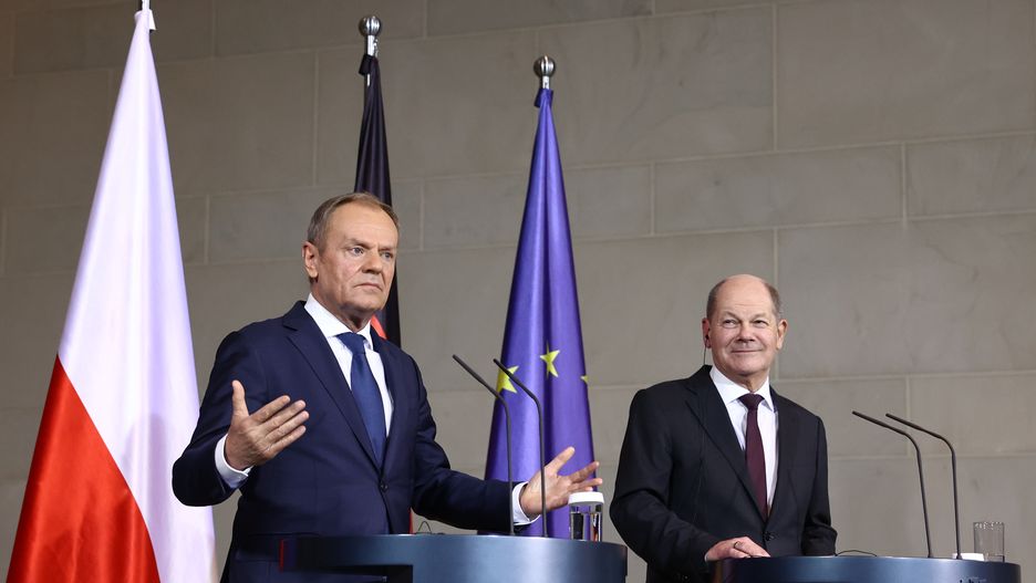 Donald Tusk, Poland's prime minister, left, and Olaf Scholz, Germany's chancellor, during a news conference at the Chancellery in Berlin, Germany, on Monday, Feb. 12, 2024. The three parties in Germany's unpopular ruling coalition suffered losses in Sunday's partial repeat in Berlin of the 2021 federal election, continuing a national trend that is likely to be repeated in four key votes this year. Photographer: Liesa Johannssen/Bloomberg via Getty Images
