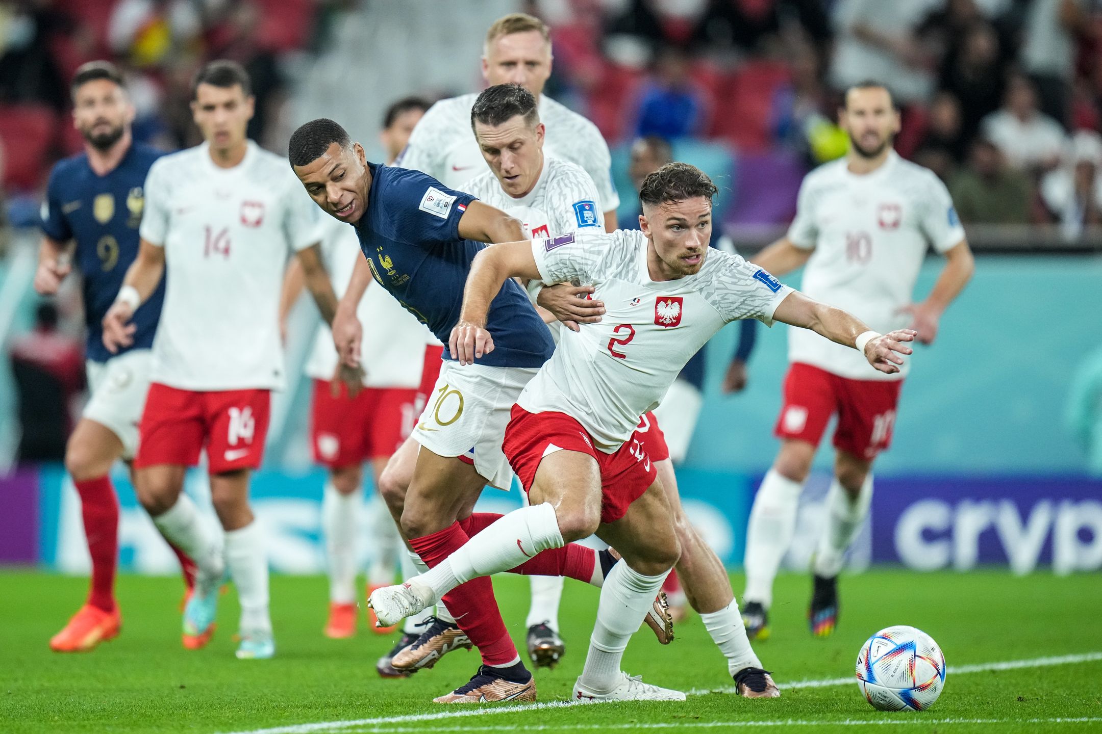 (10) MBAPPE Kylian of team France battle for ball with (2) CASH Matty and (20) ZIELINSKI Piotr of team Poland during the FIFA World Cup Qatar 2022 Round of 16 match between France and Poland at Al Thumama Stadium on 4 December 2022 in Doha, Qatar. (Photo by Ayman Aref/NurPhoto via Getty Images)