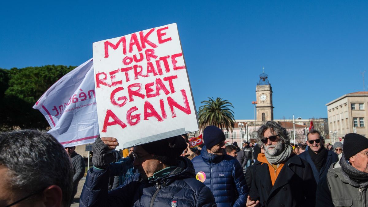 TOULON, FRANCE - 2023/01/19: A demonstrator holds a placard that says "make our retirement great again" during the demonstration. French Trade unions called for a general mobilization to protest against the the retirement and pension reforms being proposed by the government of Prime Minister Elisabeth Borne and President Emmanuel Macron. Union sources claimed 10,000 demonstrators, took to the streets in Toulon (Var).). (Photo by Laurent Coust/SOPA Images/LightRocket via Getty Images)