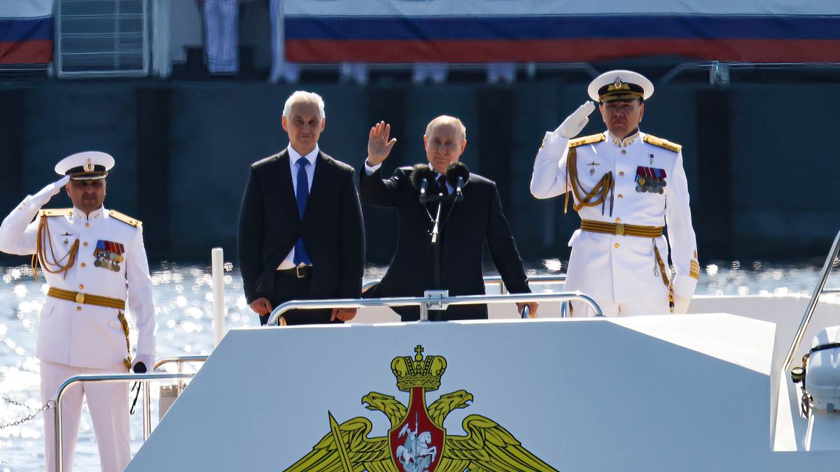 ST  PETERSBURG, RUSSIA - 2024/07/28: Russian President Vladimir Putin (center) takes part in a naval parade on a boat at the Neva River with Russian Defense Minister Andrei Belousov (left) in St. Petersburg. On the last Sunday of July, St. Petersburg will traditionally celebrate Navy Day. The ceremonial events will traditionally begin with a parade of ships. This year, for the first time in 8 years, the parade will be held without the Kronstadt unit. Russian President Vladimir Putin will traditionally deliver a speech on Senate Square in St. Petersburg. (Photo by Artem Priakhin/SOPA Images/LightRocket via Getty Images)