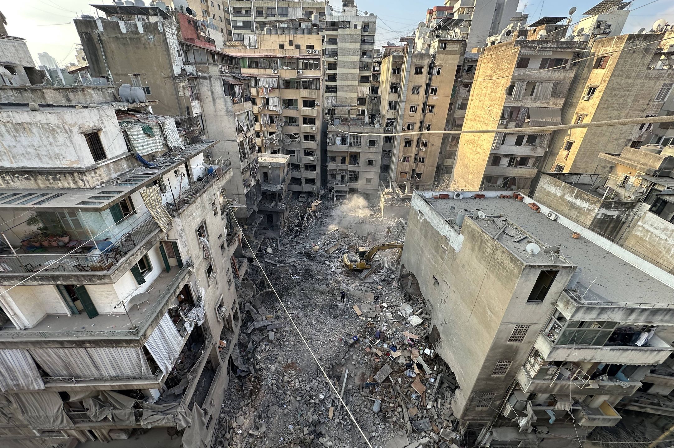 Beirut wakes up to damage after new Israeli strike hit its central area
epa11653990 Search and rescue team members try to find victims in the debris of a damaged building after an Israeli military strike on the Basta neighborhood in Beirut, Lebanon, 11 October 2024. At least 22 people were killed and 117 injured in an Israeli military strike in Beirut, Lebanon's Ministry of Public Health stated on 10 October. According to the Lebanese Ministry of Health, more than 2,100 people have been killed and over 10,000 others have been injured in Lebanon since Israel expanded its military operations to Lebanon in September 2024.  EPA/WAEL HAMZEH 
Dostawca: PAP/EPA.
WAEL HAMZEH
strike, Lebanon, military