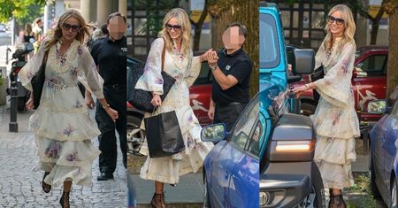 Agnieszka Woźniak-Starak w falbanach przeskakuje ogrodzenie w drodze do swego turkusowego Jeepa (ZDJĘCIA)