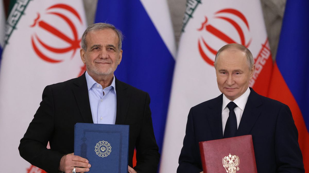 MOSCOW, RUSSIA - JANUARY 17 (RUSSIA OUT) Russian President Vladimir Putin (R) exchanges documents with Iranian President Masoud Pezeshkian (L) during their meeting at the Grand Kremlin Palace,  January 17, 2025, in Moscow, Russia. Pezeshkian arrived in Moscow for a treaty signing with Putin. (Photo by Contributor/Getty Images)