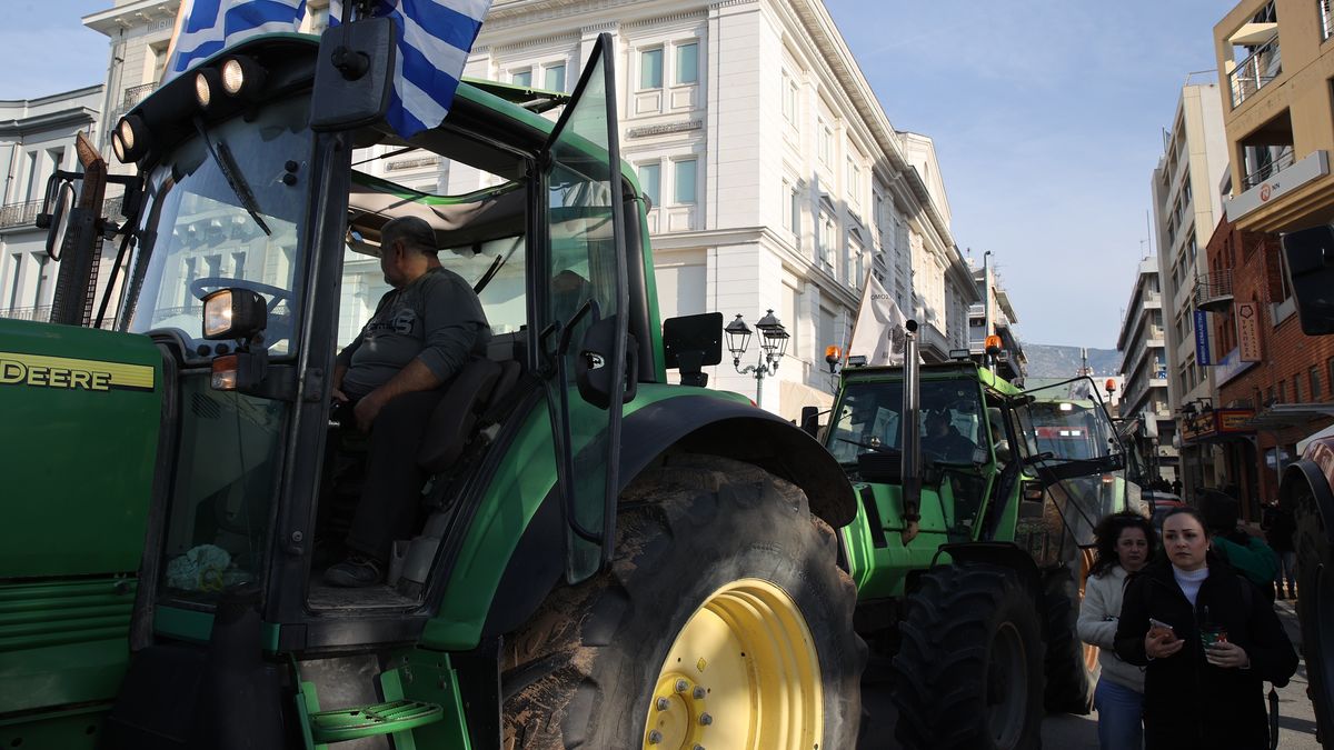 VOLOS, GREECE - DECEMBER 10: Greek farmers and livestock breeders gather at the port of Volos as part of ongoing protests over agricultural policies in Greece, blocking the main entrances with their tractors on December 10, 2025. Fishermen in the area also supported the demonstration by waiting offshore in their boats. (Photo by Ayhan Mehmet/Anadolu via Getty Images)