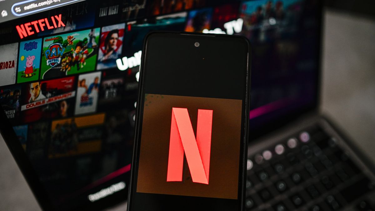 POLAND - 2026/04/07: In this photo illustration, a Netflix logo is seen displayed on a smartphone with Netflix website in the background. (Photo Illustration by Omar Marques/SOPA Images/LightRocket via Getty Images)