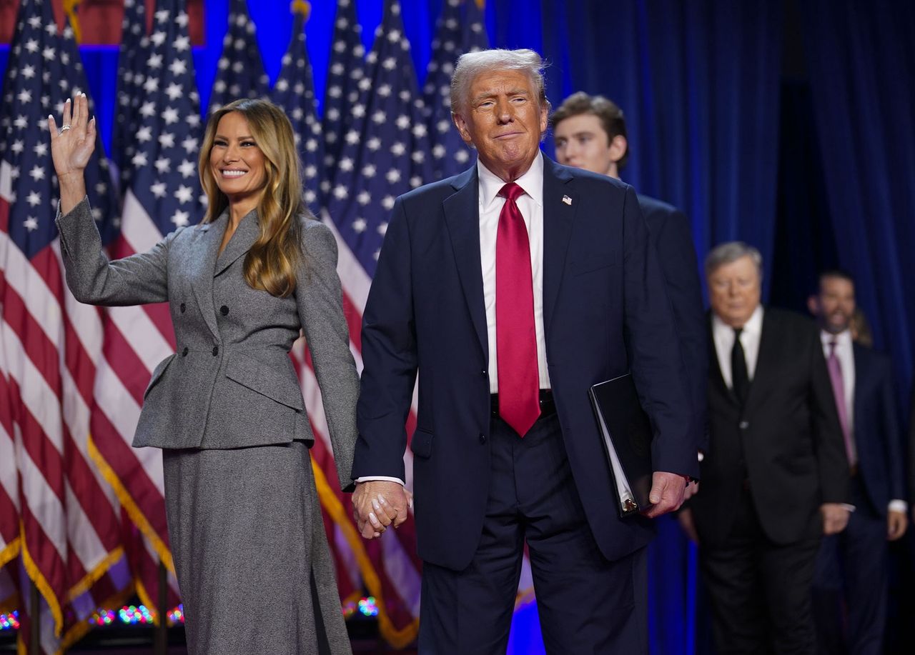 WEST PALM BEACH,FL - NOVEMBER 6: Republican presidential nominee Donald Trump walks out on stage with his wife Melania after being declared the winner during an election night watch party at the Palm Beach County Convention Center in West Palm Beach, FL, on November 6, 2024.  (Photo by Jabin Botsford/The Washington Post via Getty Images)