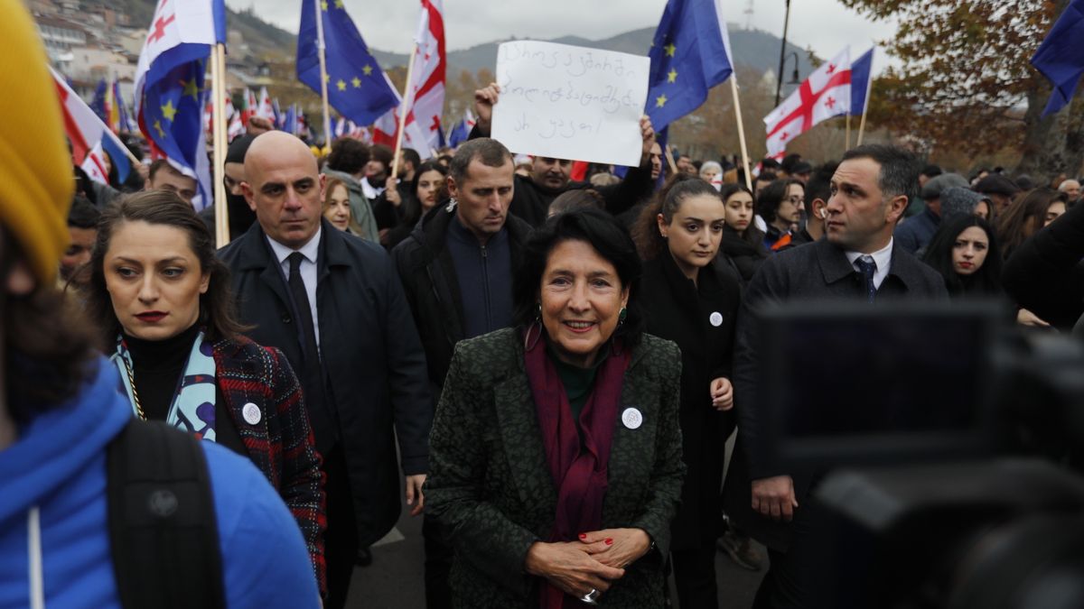 TBILISI, GEORGIA - DECEMBER 9: Georgian President Salome Zourabichvili (C) attends the march as participant spread a huge EU flag, symbolizing the European aspirations of the entire Georgian society, during the march starting from First Republic Square to end at Europe Square, to support Georgia's EU membership bid in Tbilisi, Georgia on December 9, 2023. The march organized one week ahead of the European Council's political decision on the EU enlargement package, which envisages opening negotiations on EU accession for Ukraine and Moldova and granting Georgia EU candidate status. (Photo by Mirian Meladze/Anadolu via Getty Images)