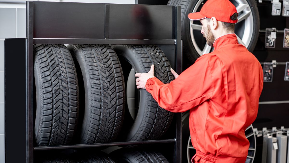Worker taking new tires
Car service worker in red uniform taking new wheel from the shelves of the wheel store
RossHelen
automotive, balancer, taking