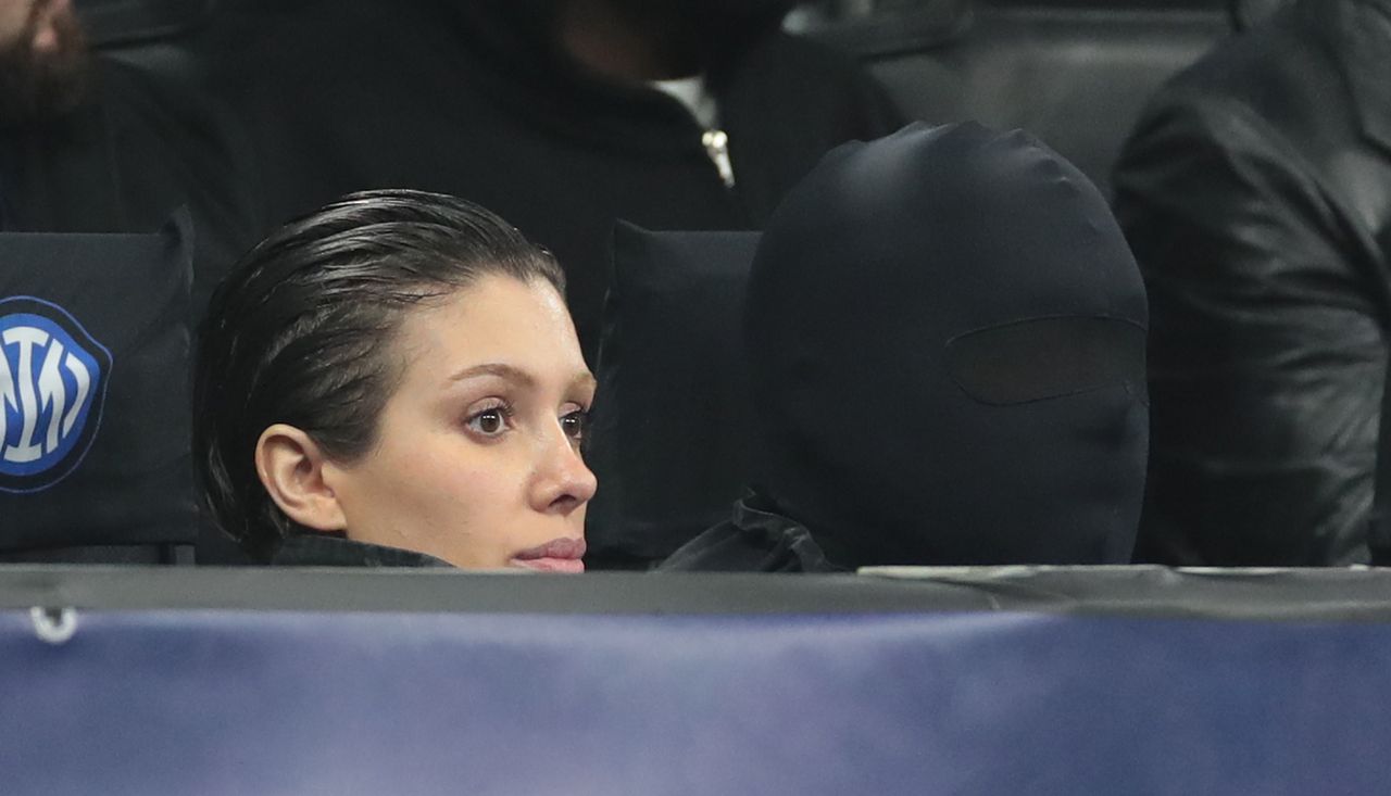 MILAN, ITALY - FEBRUARY 20: Kanye West (with the mask) and his wife Bianca Censori attend the UEFA Champions League 2023/24 round of 16 first leg match between FC Internazionale and Atletico Madrid at Stadio Giuseppe Meazza on February 20, 2024 in Milan, Italy. (Photo by Emilio Andreoli/Getty Images)