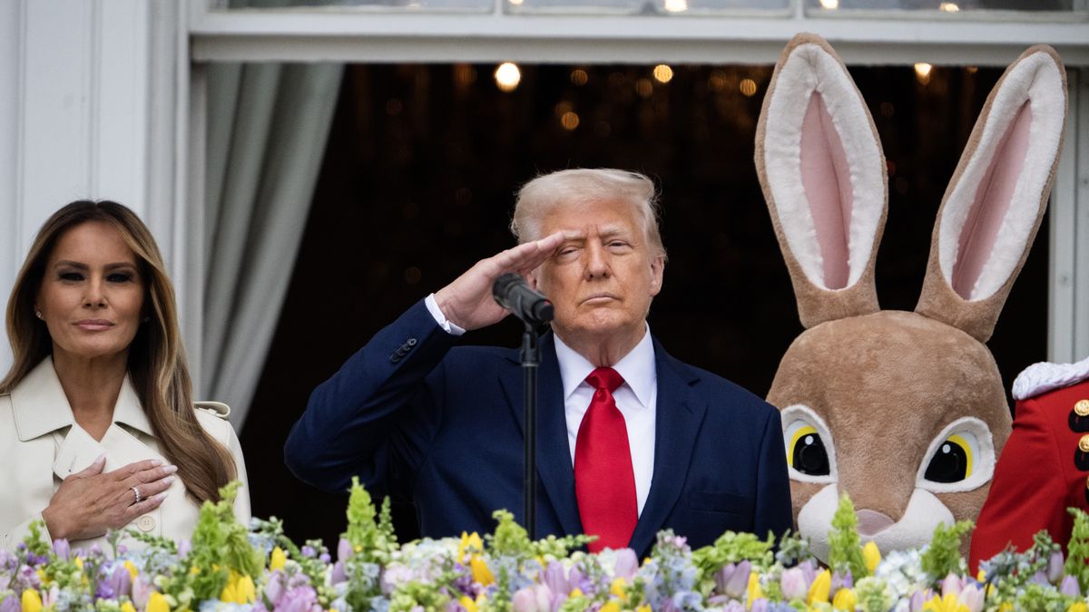 UNITED STATES - APRIL 21: President Donald Trump and first lady Melania Trump listen to Master Gunnery Sgt. Kevin Bennear of the Marine Band sing the National Anthem during the White House Easter Egg Roll on Monday, April 21, 2025. (Tom Williams/CQ-Roll Call, Inc via Getty Images)