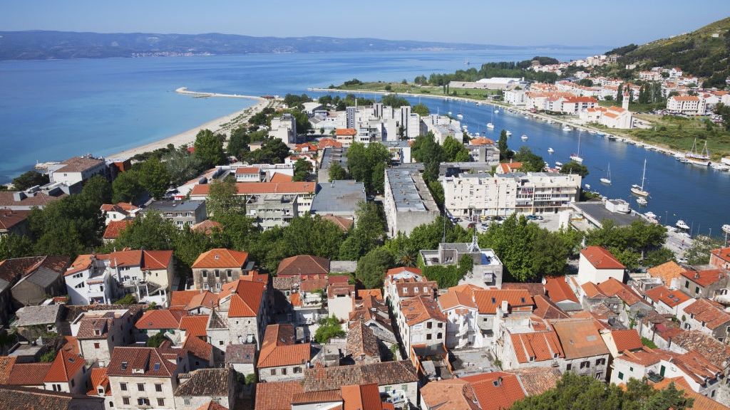 Red Rooftops and View of The Dalmatian Coast. Omis, Split-Dalmatia, Croatia
Red Rooftops and View of The Dalmatian Coast. Omis, Split-Dalmatia, Croatia. (Photo by: Jenna Szerlag/Design Pics Editorial/Universal Images Group via Getty Images)
Design Pics Editorial
boat, boats, building, coast, color, colour, dalmation, gray, harbour, holidays, residential, roof, roofs, split, traditional, tranquil, urban, vacation, warm