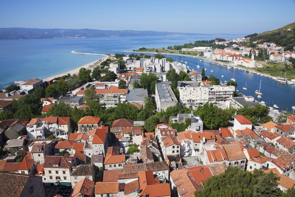 Red Rooftops and View of The Dalmatian Coast. Omis, Split-Dalmatia, Croatia
Red Rooftops and View of The Dalmatian Coast. Omis, Split-Dalmatia, Croatia. (Photo by: Jenna Szerlag/Design Pics Editorial/Universal Images Group via Getty Images)
Design Pics Editorial
boat, boats, building, coast, color, colour, dalmation, gray, harbour, holidays, residential, roof, roofs, split, traditional, tranquil, urban, vacation, warm