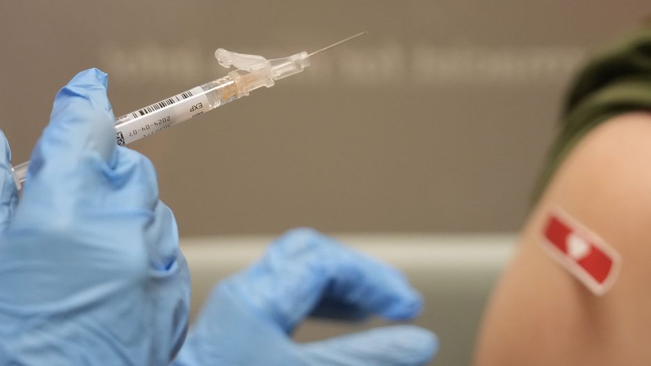 CYPRESS, TEXAS - SEPTEMBER 20: Kim Nguyen, pharmacist, prepares to give a Moderna Spikevax COVID-19 vaccine at CVS, 12550 Louetta Rd., Wednesday, Sept. 20, 2023, in Cypress. (Melissa Phillip/Houston Chronicle via Getty Images)