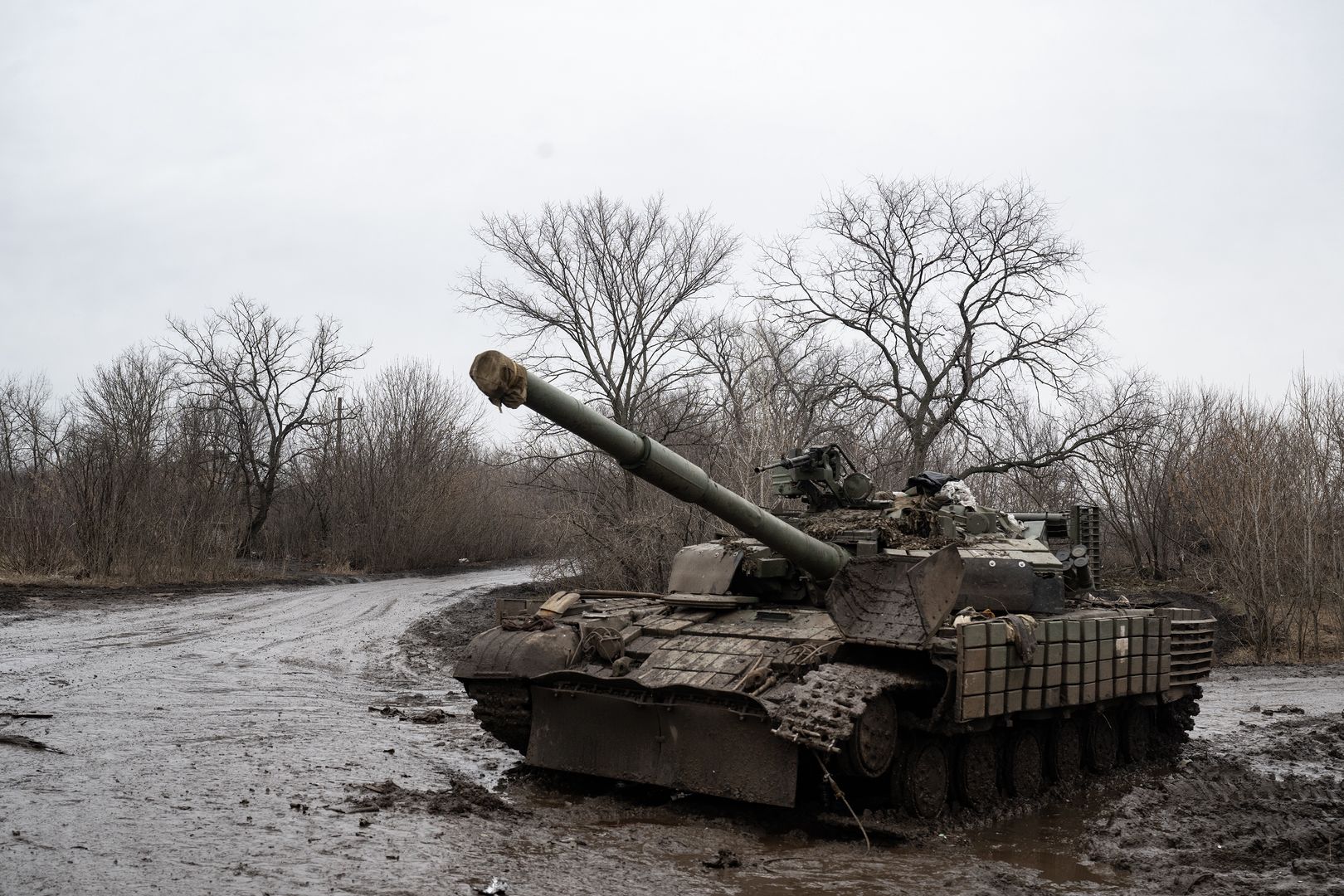 BAKHMUT, UKRAINE - FEBRUARY 13: A T-62 Battle Tank lies idle after being hit by a Russian Lancet drone a few hours earlier in a village outside Bakhmut on February 13, 2024 in Bakhmut, Donbas, Ukraine. The Senate passed a long-awaited foreign aid package for Ukraine and Israel early Tuesday morning, delivering a bipartisan endorsement of the legislation after months of negotiations, dire battlefield warnings and political mudslinging. As the two-year anniversary of Russias full scale invasion approaches, the Ukrainian military is running low on soldiers and ammunition across the frontline. (Photo by Lynsey Addario/Getty Images)