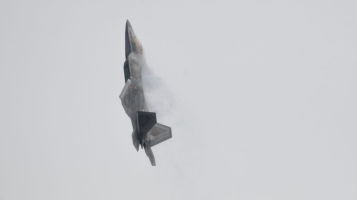 A U.S. Air Force F-22 Raptor fighter jet, manufactured by Lockheed Martin Corp., performs a maneuver during a media preview day at the Singapore Airshow held at the Changi Exhibition Centre in Singapore, on Sunday, Feb. 9, 2020. Lockheed Martin and Raytheon Co. are among more than 70 international aviation companies withdrawing from Asia's largest aerospace and defense conference in Singapore as concerns mount over the coronavirus outbreak. Lockheed Martin Corp and Raytheon Co. are among more than 70 international aviation companies withdrawing from Asia's largest aerospace and defense conference in Singapore as concerns mount over the coronavirus outbreak. Photographer: SeongJoon Cho/Bloomberg via Getty Images