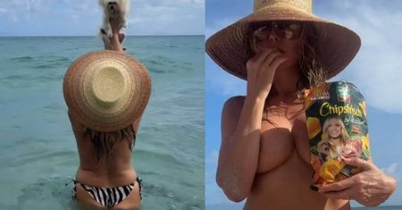 Heidi Klum TOPLESS zajada chipsy z własną podobizną i pluska się w wodzie. Fajnie się bawi? (FOTO)