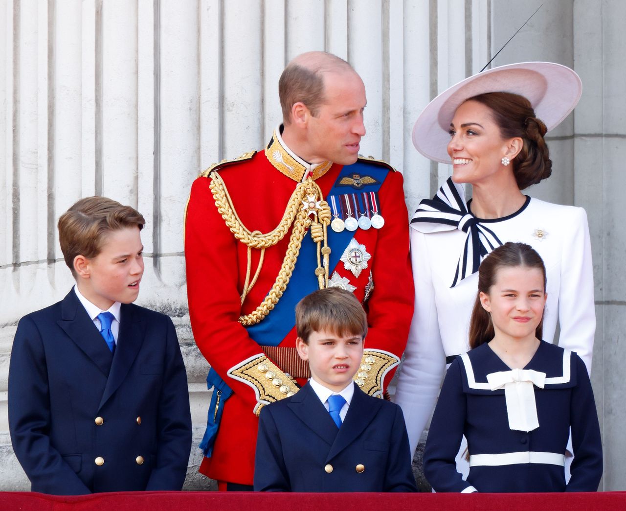 LONDON, UNITED KINGDOM - JUNE 15: (EMBARGOED FOR PUBLICATION IN UK NEWSPAPERS UNTIL 24 HOURS AFTER CREATE DATE AND TIME) Prince George of Wales, Prince William, Prince of Wales (Colonel of the Welsh Guards), Prince Louis of Wales, Princess Charlotte of Wales and Catherine, Princess of Wales watch an RAF flypast from the balcony of Buckingham Palace after attending Trooping the Colour on June 15, 2024 in London, England. Trooping the Colour, also known as The King's Birthday Parade, is a military ceremony to mark the official birthday of the British Sovereign. The ceremony takes place at Horse Guards Parade followed by a flypast over Buckingham Palace and was first performed in the mid-17th century during the reign of King Charles II. The parade features all seven regiments of the Household Division with Number 9 Company, Irish Guards being the regiment this year having their Colour Trooped. (Photo by Max Mumby/Indigo/Getty Images)