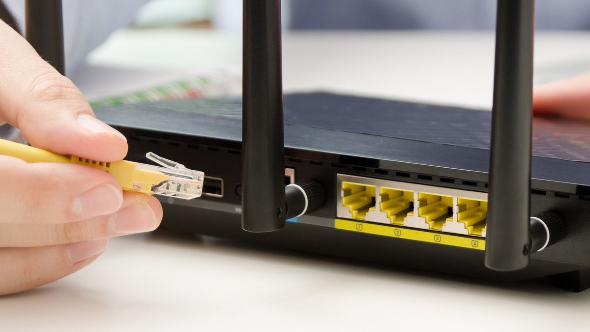 Man plugs Ethernet cable into routerMan plugs Ethernet cable into router. router wireless wire broadband home office cable plug conceptrouter, wireless, wire, broadband, home, office, cable, plug, switch, laptop, computer, wifi, technology, secure, ethernet, support, wan, network, plug-in, modern, telecommunication, internet, wi-fi, gateway, work, wlan, access, antenna, black, business, communication, connect, connection, data, digital, electronic, equipment, firewall, hardware, lan, mobile, speed, device, horizontal, male, man, on-line, person, router, wireless, wire, broadband, home, office, cable, plug, switch, laptop, computer, wifi, technology, secure, ethernet, support, wan, network, plug-in, modern, telecommunication, internet, wi-fi, gateway, work, wlan, access, antenna, black, business, communication, connect, connection, data, digital, electronic, equipment, firewall, hardware, lan, mobile, speed, device, horizontal, male, man, on-line, person