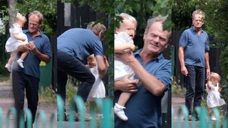 Opiekuńczy Donald Tusk spaceruje z wnuczką po Trójmieście, dzierżąc w dłoniach jej różowy smoczek (ZDJĘCIA)