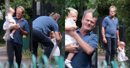 Opiekuńczy Donald Tusk spaceruje z wnuczką po Trójmieście, dzierżąc w dłoniach jej różowy smoczek (ZDJĘCIA)