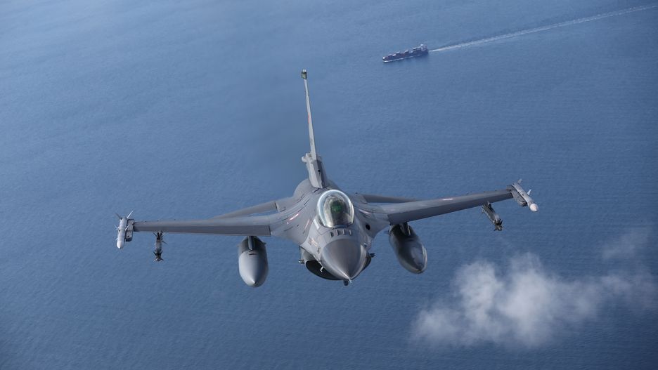 MALBORK, POLAND - AUGUST 27: Turkish F-16 fighter jet pilots fly by C-295M Casa military cargo plane of Poland as F-16 fighter jets of Turkish Air Forces serve in NATO's "Air Policing" mission at 22nd Air Base Command in Malbork, Poland on August 27, 2021. (Photo by Cuneyt Karadag/Anadolu Agency via Getty Images)