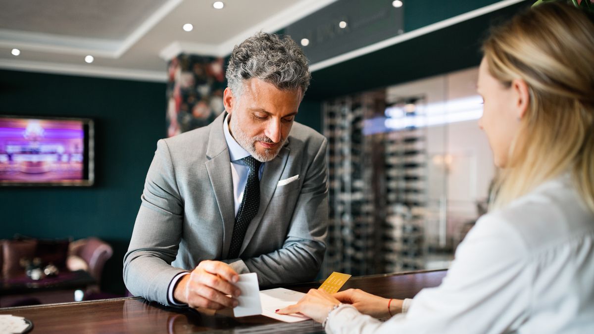 Mature businessman at hotel reception.
Mature businessman checking in at hotel reception.
business, man, mature, handsome, hotel, trip, business trip, gray, grey, hair, shirt, tie, work, job, career, occupation, journey, entrepreneur, business person, businessman, indoors, working, background, adult, inside, accomodation, interior, suit, holding, bar, reception, receptionist, female, checking in, TV, screen, desk, ckeck-in, check in, check