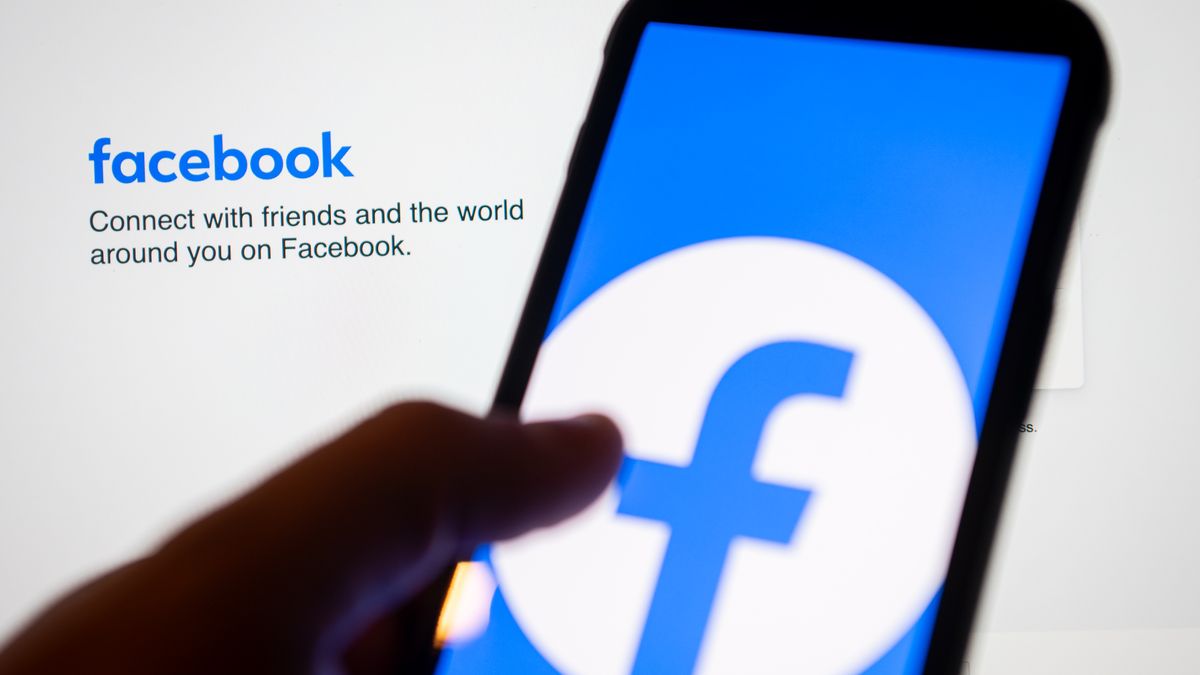 POLAND - 2024/09/13: In this photo illustration, the Facebook logo seen displayed on a smartphone and in the background. (Photo Illustration by Mateusz Slodkowski/SOPA Images/LightRocket via Getty Images)