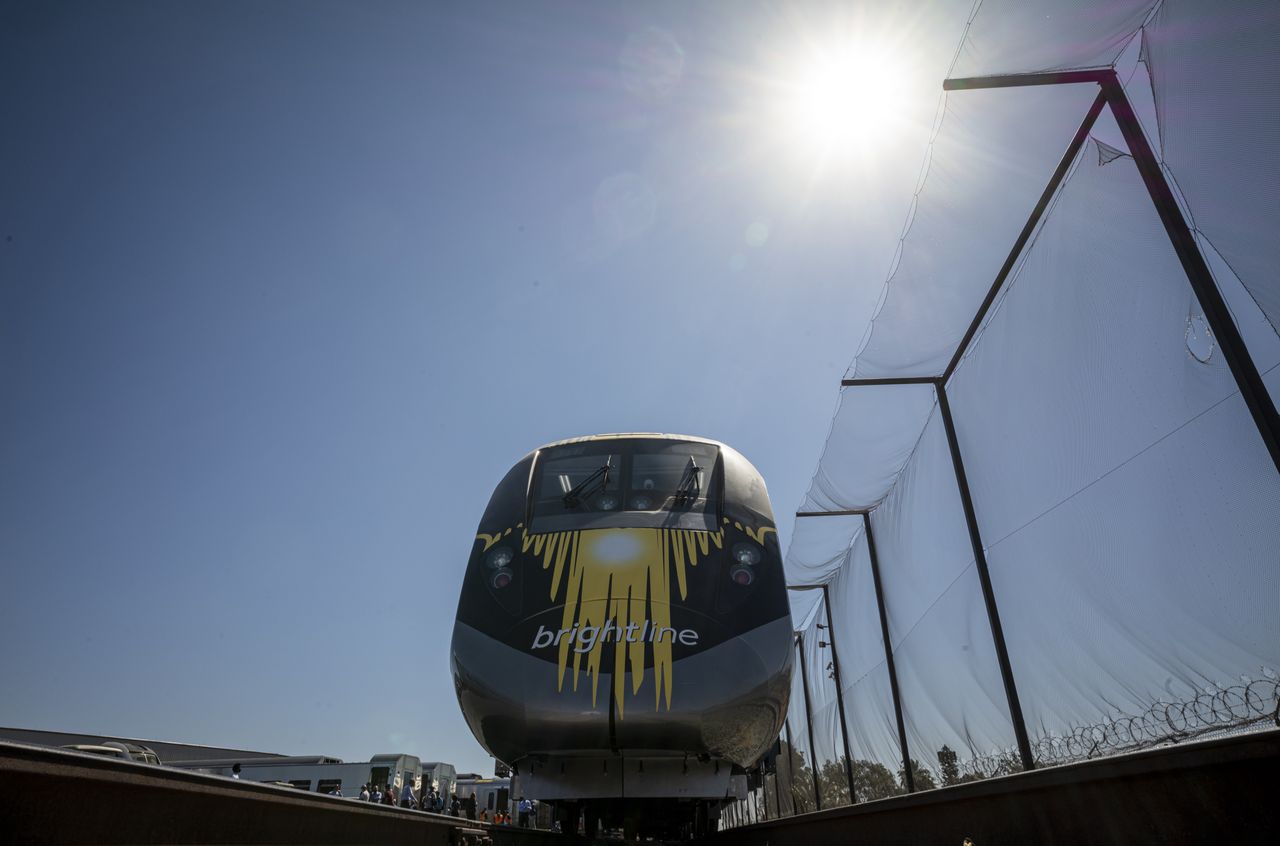 In the picture, an express intercity train on the Brightline railway route.