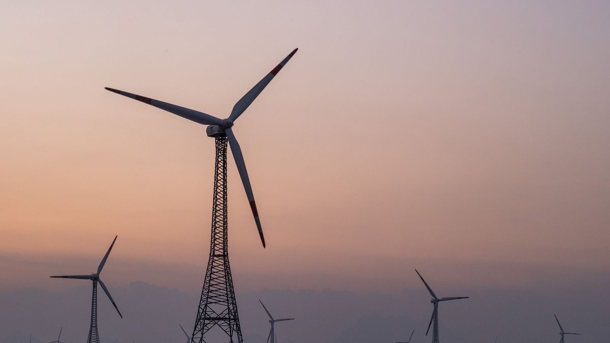 Wind turbines in the vicinity of the Kudankulam Nuclear Power Plant (KNPP), near Kudankulam, India on Thursday, March 21, 2024. India, the world's most-populous nation, has signaled that it will reduce its dependence on the fossil fuel, but growing energy needs complicate the equation. Photographer: Prashanth Vishwanathan/Bloomberg via Getty Images