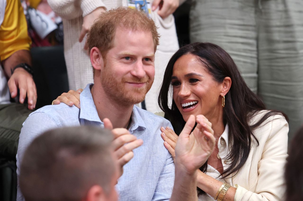 DUESSELDORF, GERMANY - SEPTEMBER 15: Prince Harry, Duke of Sussex and Meghan, Duchess of Sussex sit with Germany and Poland fans as they attend the sitting volleyball match between Poland and Germany at the Merkur Spiel-Arena during day six of the Invictus Games Düsseldorf 2023 on September 15, 2023 in Duesseldorf, Germany. Prince Harry celebrates his 39th birthday today. (Photo by Chris Jackson/Getty Images for the Invictus Games Foundation)