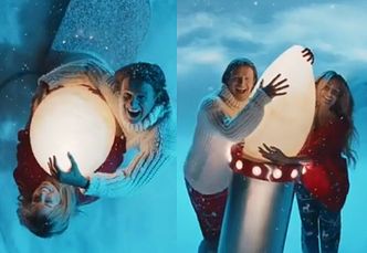 Świąteczni "Pączek i Pysiula" przytulają się do wielkiej lampki choinkowej w nowym spocie reklamowym