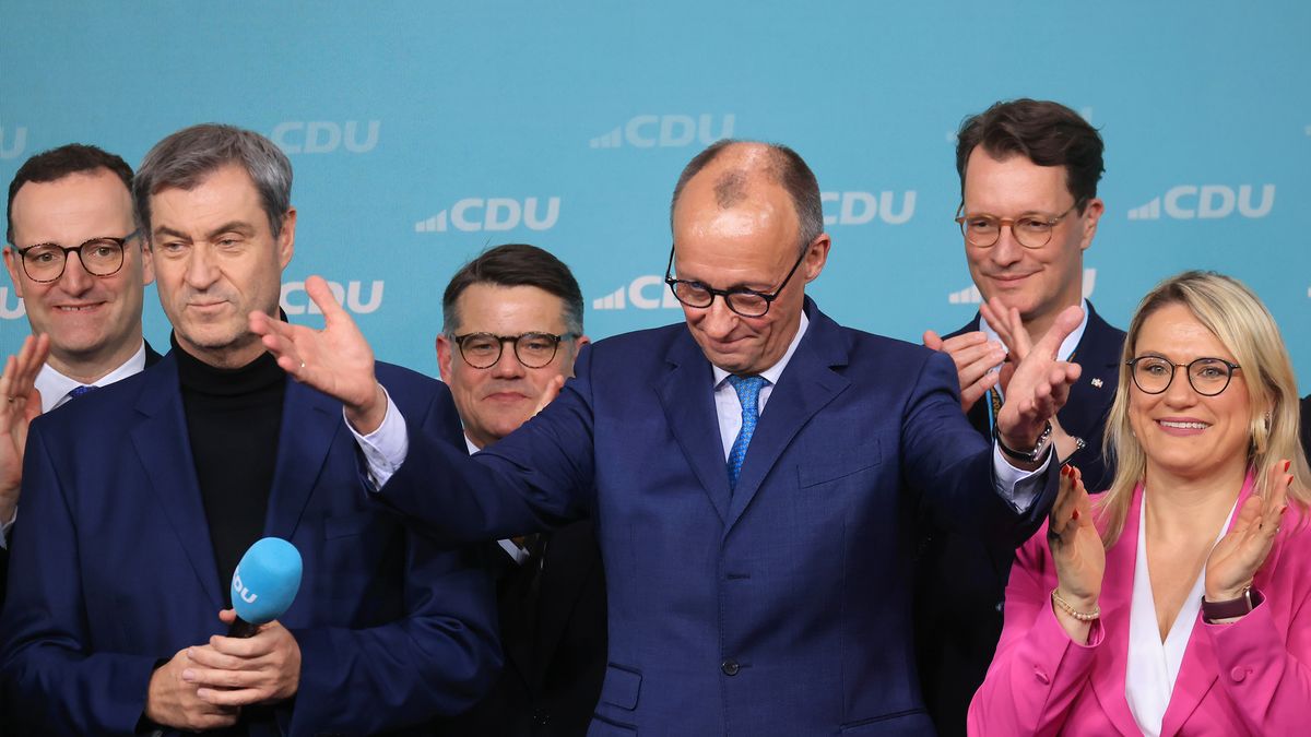 Friedrich Merz, leader of the Christian Democratic Union (CDU), center, at the party's election night event in Berlin, Germany, on Sunday, Feb. 23, 2025. Germany's conservative opposition leader Merz said he'll move quickly to form a new government after he won Sunday's federal election with a result that will require him to form a coalition. Photographer: Krisztian Bocsi/Bloomberg via Getty Images