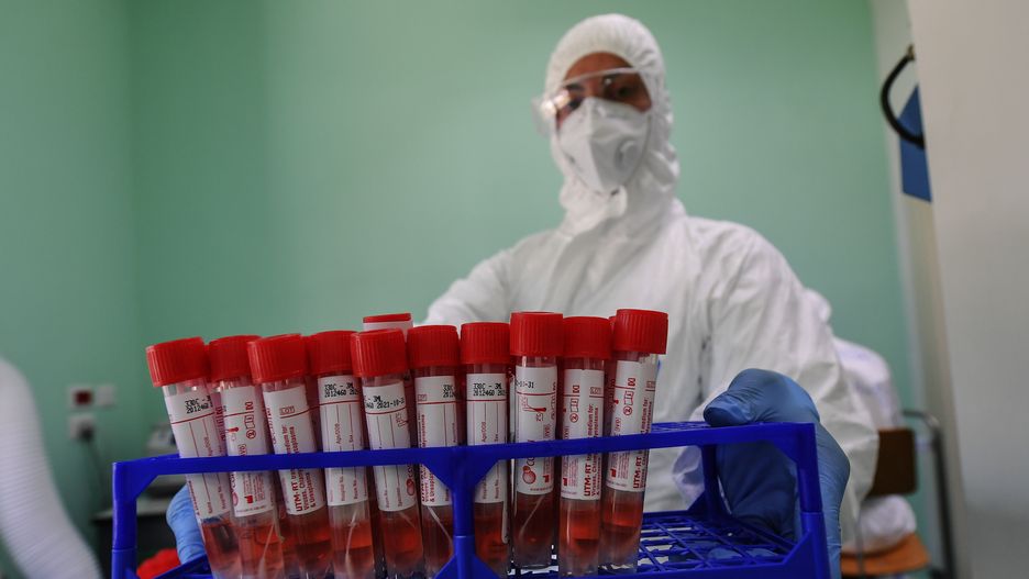 NAPLES, CAMPANIA, ITALY - 2020/06/13: A medical technician works in the laboratory of the Infectious diseases department for coronavirus (COVID-19)handling samples of coronavirus COVID 19 tests at the microbiology laboratory of Naples. (Photo by Salvatore Laporta/KONTROLAB/LightRocket via Getty Images)