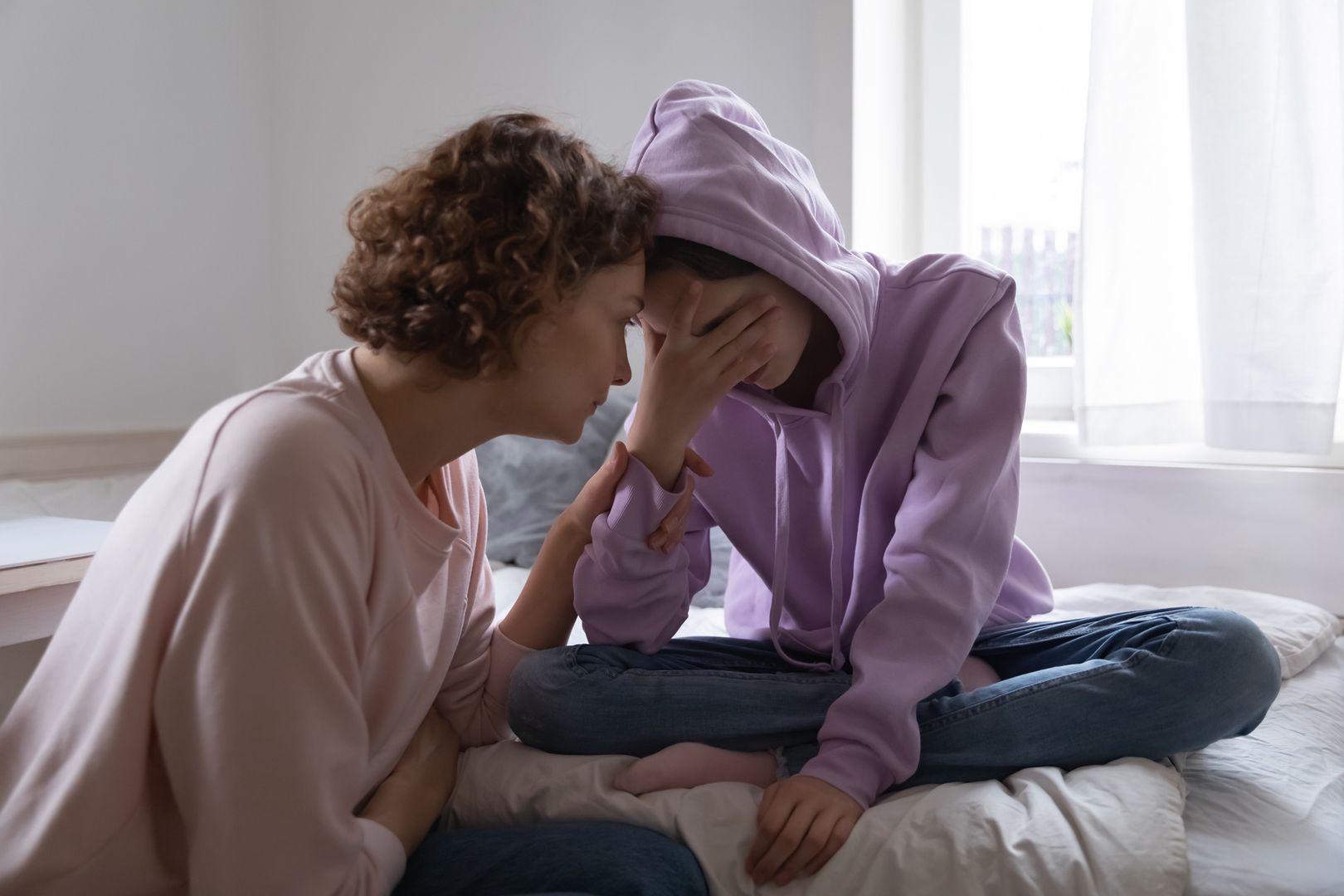 Worried mom comforting depressed teen daughter crying at home
Worried parent young mom comforting depressed crying teen daughter bonding at home. Loving understanding mother apologizing or supporting sad teenage girl having psychological puberty problem concept.
fizkes