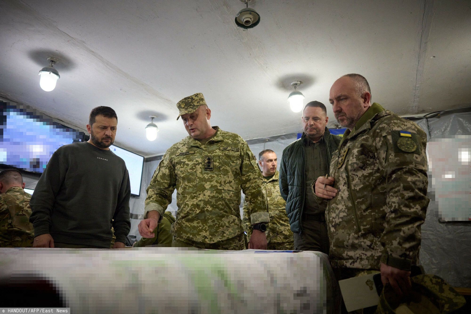 Temporary
This handout photograph taken and released by the Ukrainian Presidential Press Service on October 3, 2023 shows the Ukrainian President Volodymyr Zelensky (L) looking at maps during a visit to the location of the 103rd Separate Brigade of the Territorial Defense Forces of the Armed Forces of Ukraine, the 68th Separate Yeger Brigade, and the 25th Separate Sicheslav Airborne Brigade, which are performing combat missions in the Kupyansk-Lyman area, in the Kharkiv region. (Photo by Handout / UKRAINIAN PRESIDENTIAL PRESS SERVICE / AFP) / RESTRICTED TO EDITORIAL USE - MANDATORY CREDIT "AFP PHOTO / UKRAINIAN PRESIDENTIAL PRESS SERVICE" - NO MARKETING NO ADVERTISING CAMPAIGNS - DISTRIBUTED AS A SERVICE TO CLIENTS
HANDOUT