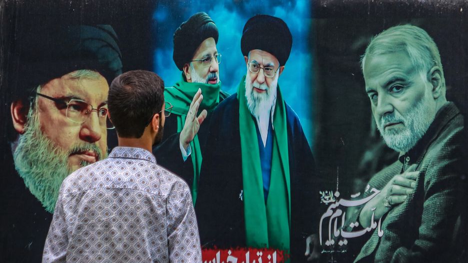 A man looks at a billboard featuring the portraits of (Left to Right) Hassan Nasrallah, the slain former leader of Hezbollah, Iran's late president Ebrahim Raisi, Iran's Supreme Leader, Ayatollah Ali Khamenei, and Iran's slain commander Qasem Soleimani, in Srinagar, Jammu and Kashmir, on June 17, 2025. Israeli Prime Minister Benjamin Netanyahu, in an interview with ABC News, states that killing Iran's Supreme Leader Ayatollah Ali Khamenei would end the conflict between the two countries. He also defends Israel's ongoing military actions against Iran, adding they aim to end the conflict rather than escalate it. His remarks come after reports that US President Donald Trump previously vetoed an Israeli plan to target Iran's Supreme Leader, fearing it could worsen the conflict. Israel continues its strikes across Iran since June 13, targeting nuclear and energy facilities, and a state television building in Tehran. In response, Iran launches waves of retaliatory missiles and drones toward Israel. (Photo by Firdous Nazir/NurPhoto via Getty Images)
