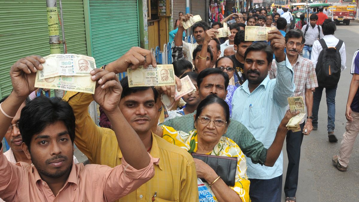 Scenes at Indian Banks in Kolkata
Indian Showing 1000 and 500 rupee and   long time waiting  a long line  Many Deposit and change old to new currency at Front of STATE BANK OF INDIA (SBI) - Salkiya HOWRAH Branch ,in Kolkata, India, on 10 November 2016  at 11.10AM. Bank not to open .In a surprise announcement late Tuesday, Prime Minister Narendra Modi banned 500-rupee ($7.50) and 1,000-rupee notes effective midnight, sweeping away 86 percent of total currency in circulation. In panic people flocked to their nearest ATMs, Petrol Pumps and Railway station to get change cash. (Photo by Debajyoti Chakraborty/NurPhoto via Getty Images)
NurPhoto
Banking, Central Bank, Economy, Finance and Economy, Headquarters, Horizontal, India, Indian Subcontinent Ethnicity, New Delhi, Paper Currency, People, Photography, Reserve Bank of India