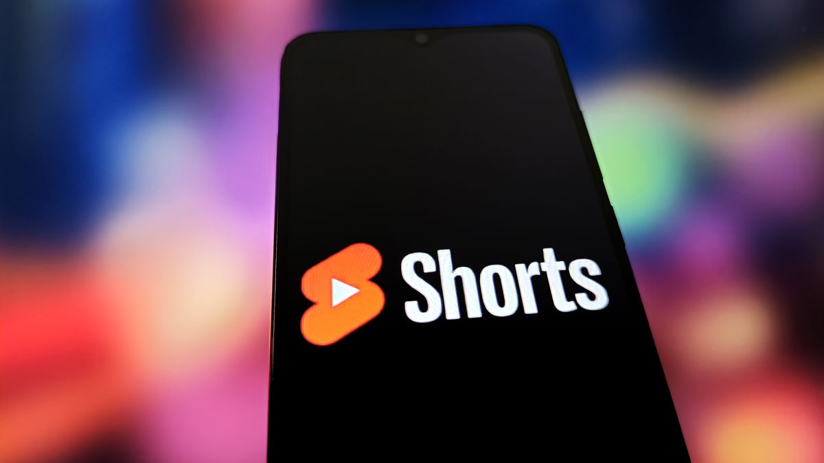 An illustration shows the SHORTS LOGO on a smartphone with the YOUTUBE LOGO in the background in Suqian, China, on March 6, 2025. (Photo Illustration by Costfoto/NurPhoto via Getty Images)
