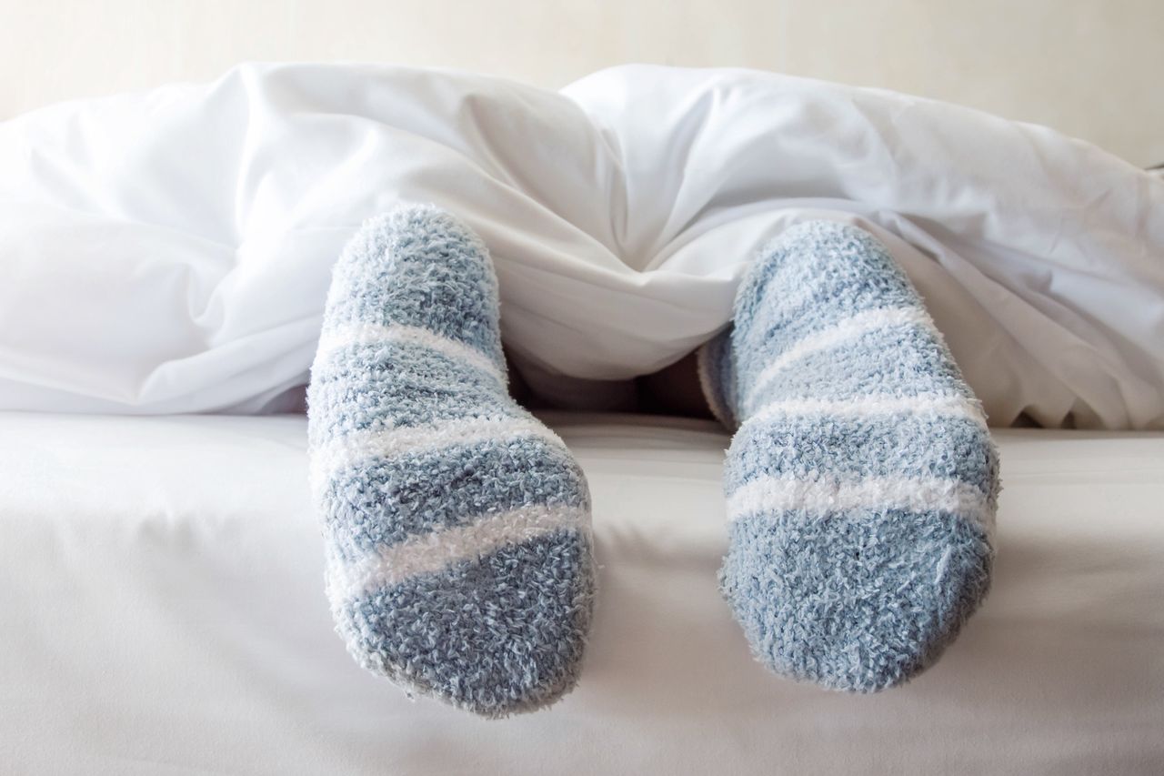 Sleeping in socks can have negative effects.