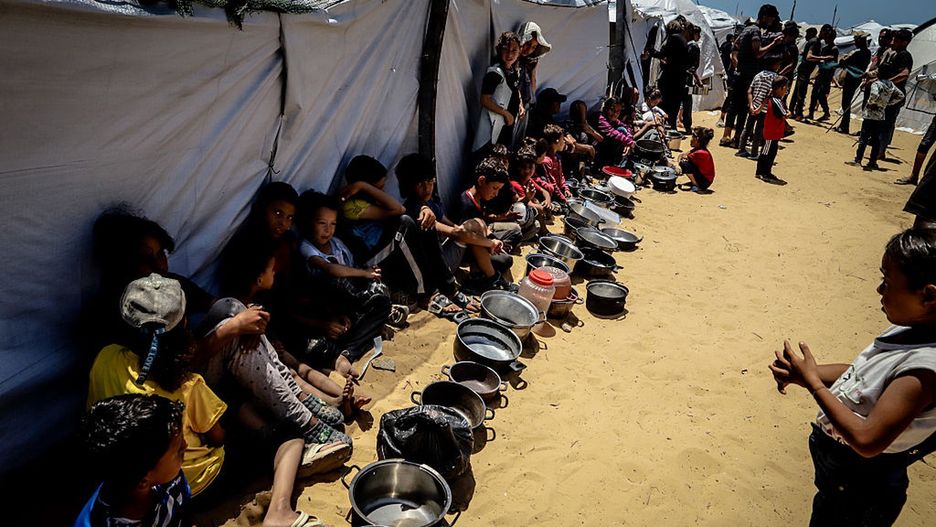 Displaced Palestinians queue for hot meals amid worsening crisis in Gaza
GAZA CITY, GAZA - MAY 27: Charitable organizations distribute hot meals to Palestinians, who are struggling with hunger due to Israel's attacks, in Gaza City, Gaza, on May 27, 2025. As Israel's relentless and devastating attacks on the Gaza Strip continue, Israeli policies have exacerbated the already severe humanitarian crisis in the region. (Photo by Saeed Jaras/Anadolu via Getty Images)
Anadolu
blockade, hunger, humanitarian support, ngos in gaza, conflict zone, charitable organizations, humanitarian crisis, war impact, palestinians, daily life in gaza, middle east conflict, hot meals, ivilian suffering, emergency relief, israeli attacks
