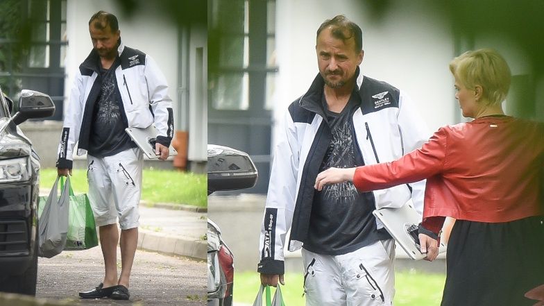 Monika Zamachowska otwiera drzwi do samochodu Konradowi Wojterskowskiemu