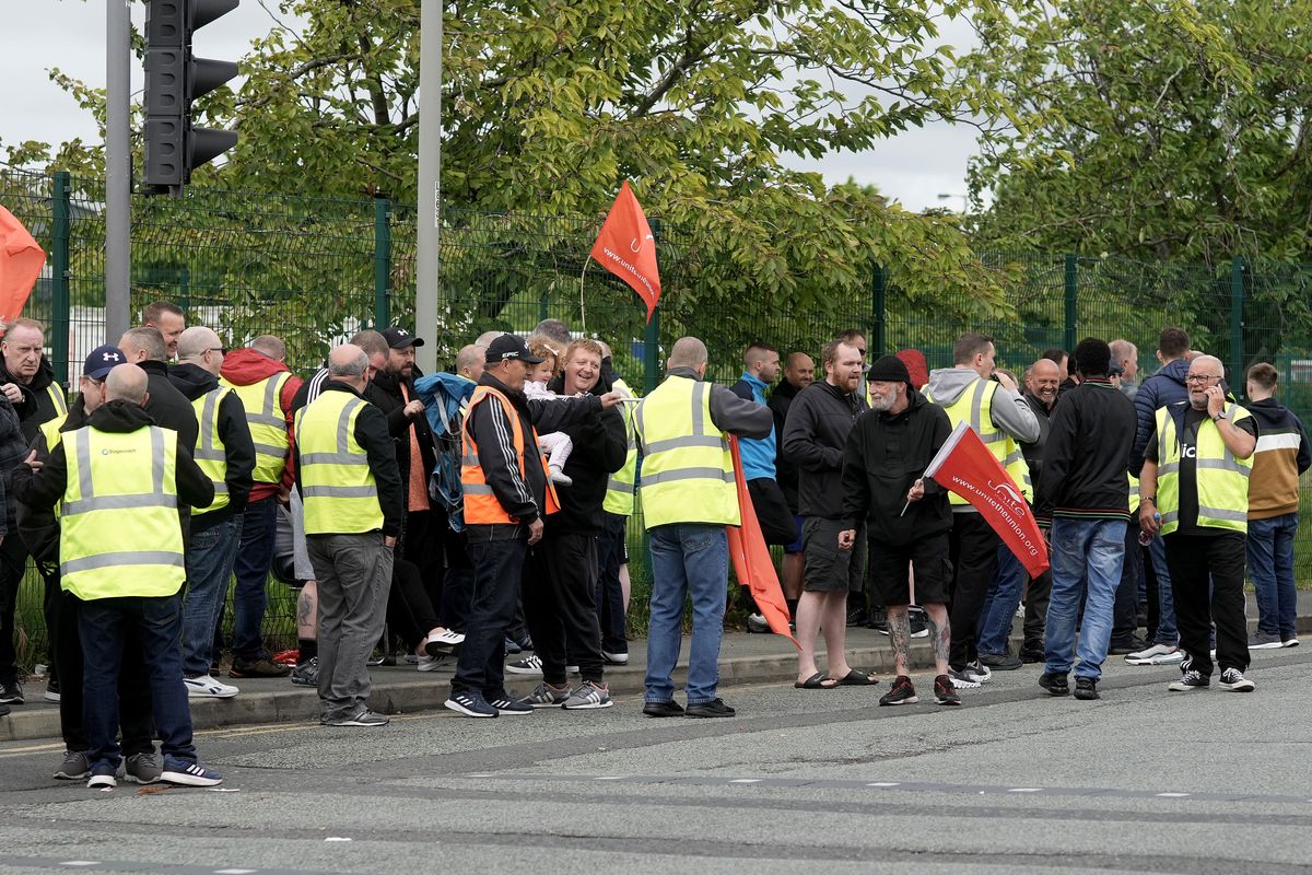 LIVERPOOL, ENGLAND - JULY 04: Bus drivers and engineers from Stagecoach Merseyside strike outside the company's Gilmoss depot on July 04, 2022 in Liverpool, England. Unite union members are striking over pay and will continue their disruption if union talks with management continue to fail. (Photo by Christopher Furlong/Getty Images)