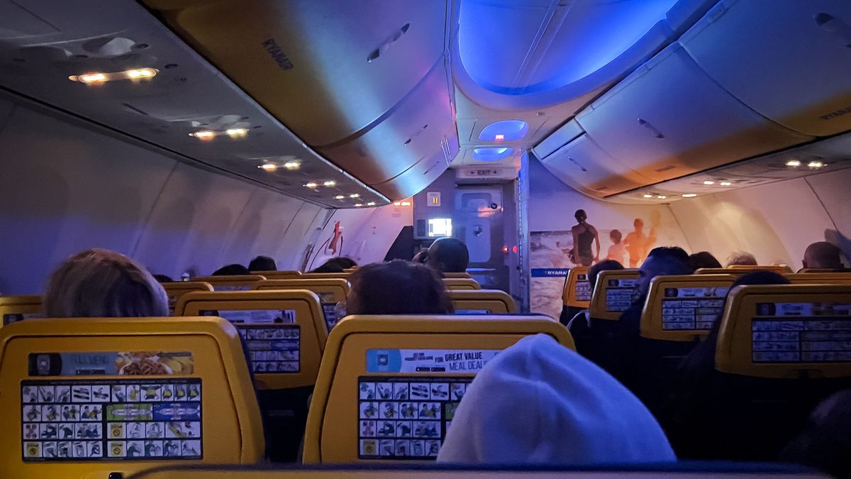 The interior cabin of a Ryanair Boeing 737 MAX 8 is seen with blue LED lighting during a night flight from Paphos to Rome, on November 9, 2023. (Photo by Mateusz Wlodarczyk/NurPhoto via Getty Images)