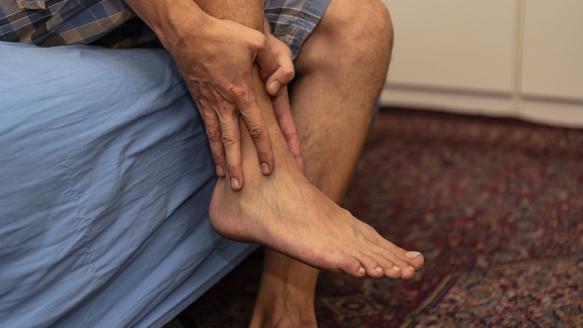 Man is Sitting at Home and Having a Problems with Ankle
Close up View of Mature Man who is Suffering from Pain in Leg Ankle while Sitting at the Couch at Home. He is Holding and Massaging his Leg to Relieve the Pain with Painful Grimace on his Face.
ProfessionalStudioImages