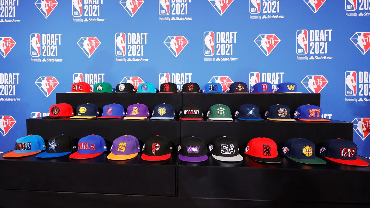 NEW YORK, NEW YORK - JULY 29: A general view of hats on a table during the 2021 NBA Draft at the Barclays Center on July 29, 2021 in New York City. (Photo by Arturo Holmes/Getty Images)