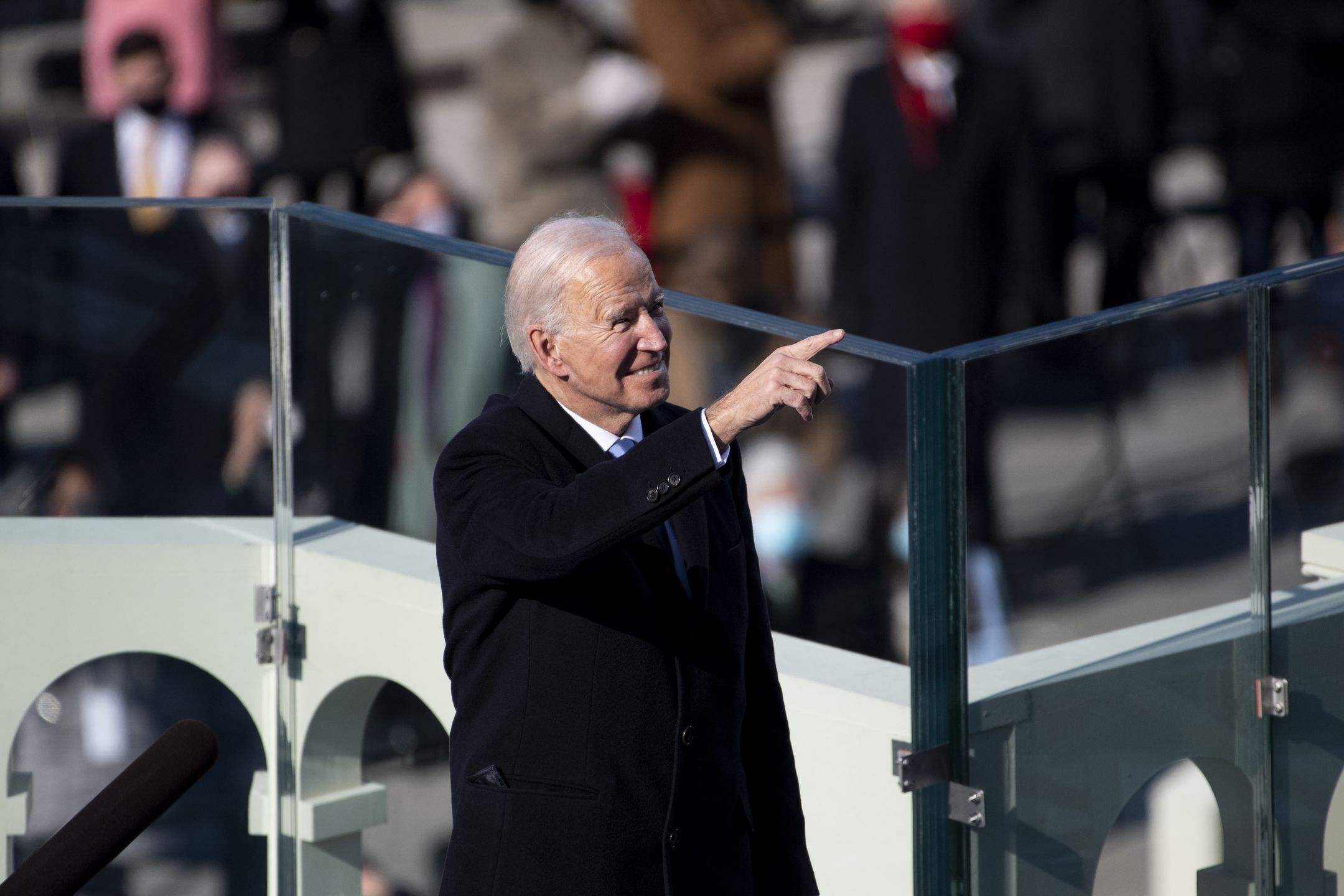 UNITED STATES - January 20: President Joe Biden points to guests attending the Inauguration ceremony after he is sworn in as the 46th President of the United States by Supreme Court Chief Justice John Roberts on the West Front of the Capitol on Wednesday, Jan. 20, 2021. (Photo by Caroline Brehman/CQ-Roll Call, Inc via Getty Images)