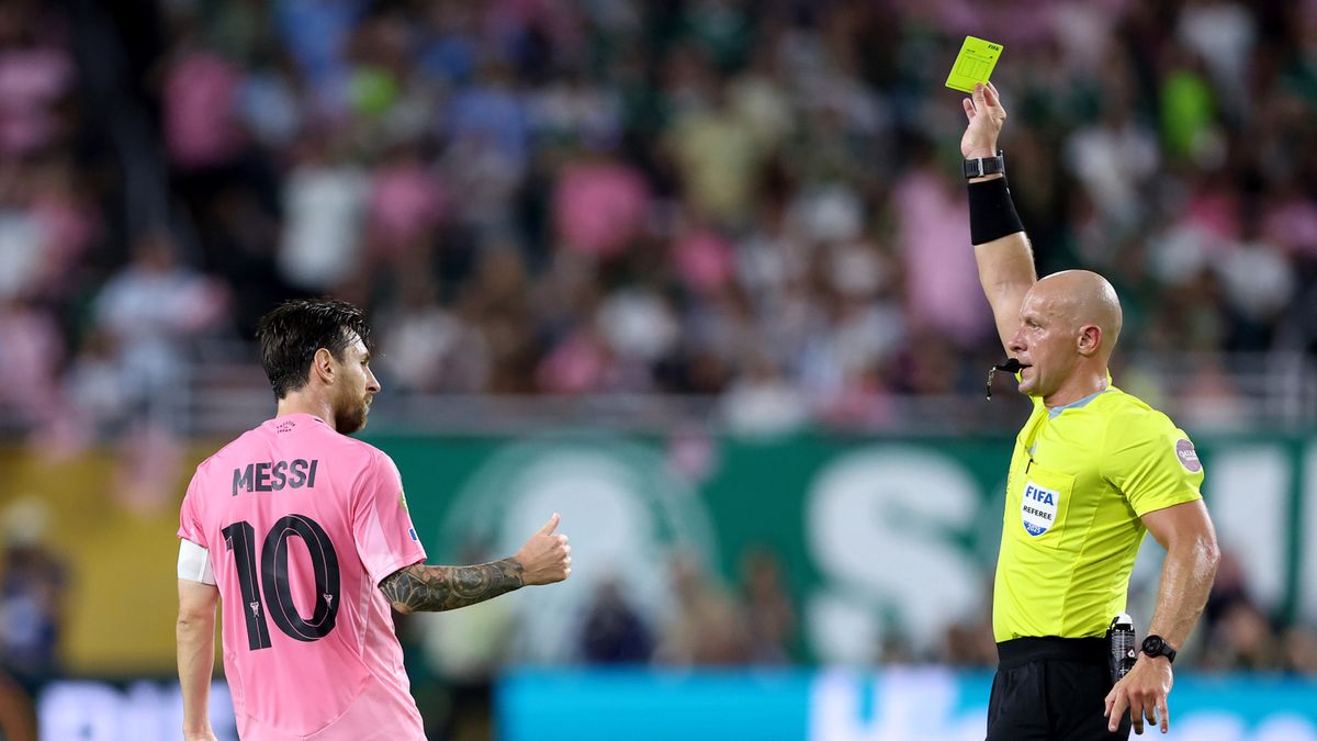 Getty Images / Megan Briggs / Szymon Marciniak i Lionel Messi